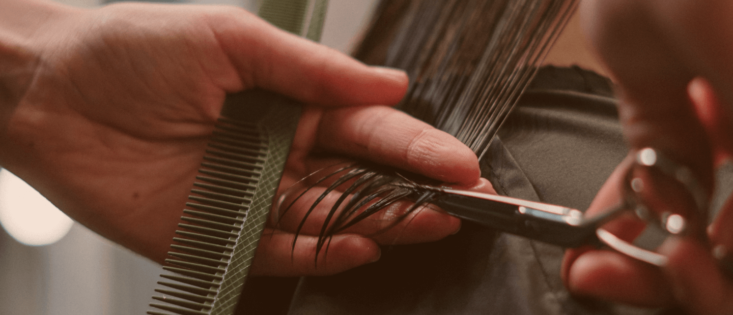 hands cutting hair